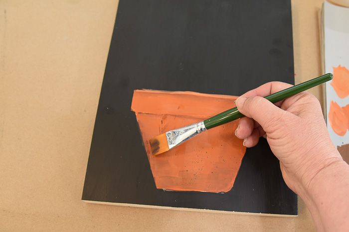 Paint a Terra Cotta Pot in acrylics. Painting clay pots is a great way to start a floral painting. I show you how step by step, with video and pattern