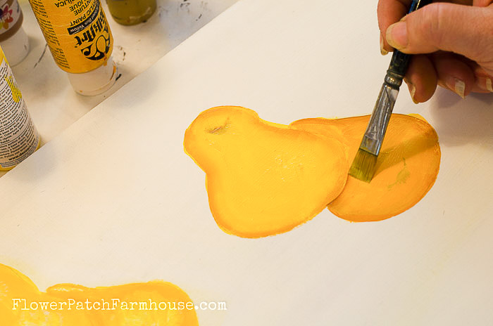 Paint a pear in acrylics, shadowing over second pear
