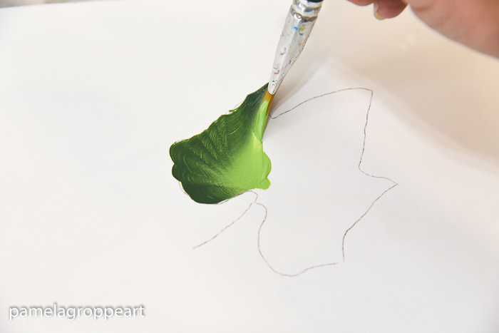 painting a pumpkin leaf in folk art acrylic paints