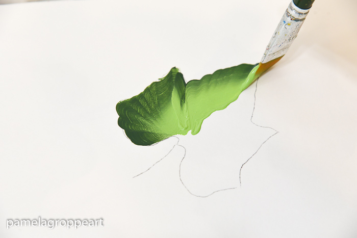 painting a pumpkin leaf in folk art acrylic paints