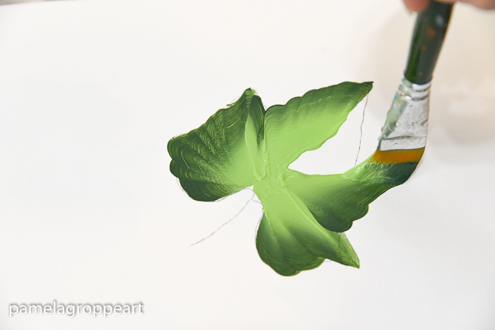 painting a pumpkin leaf in folk art acrylic paints