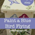 DIY bench painted with flowers and birds with text overlay, pamelagroppe.com