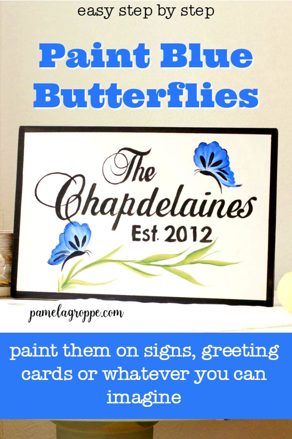 Blue butterflies hand painted on a sign, with text overlay, pamelagroppe.com