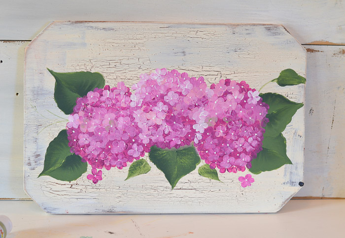 Painted pink hydrangeas on a crackled background