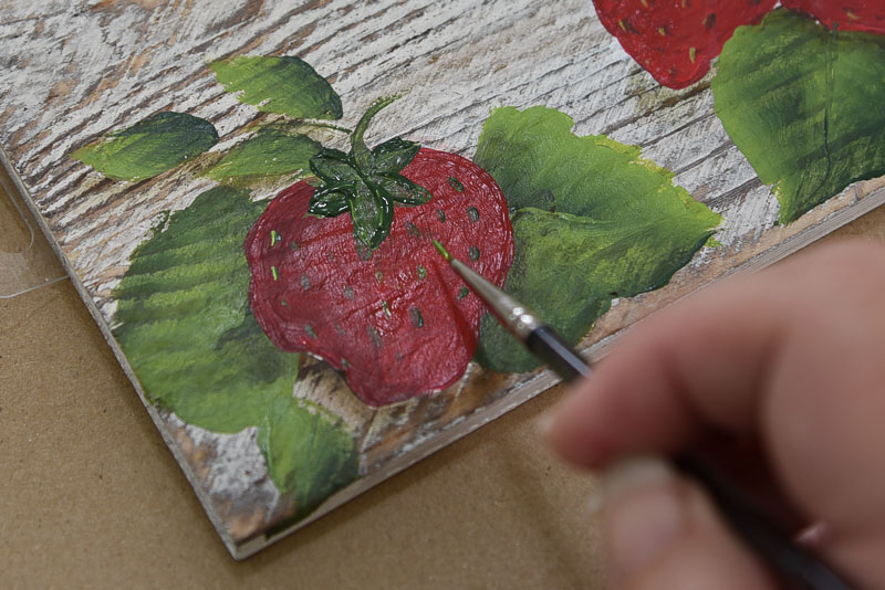 painting on strawberry seeds, 