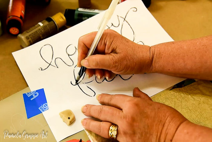 transferring happy fall lettering to diy sign with white graphite paper