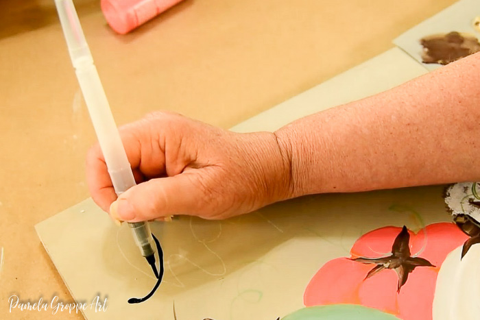painting on happy fall lettering with watercolor brush pen