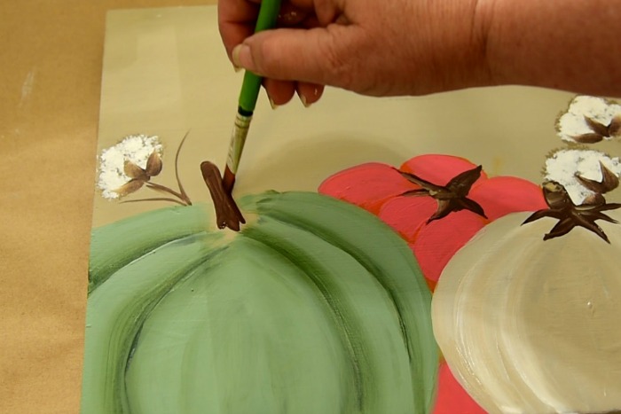 Painting a pumpkin stem on a diy happy fall sign