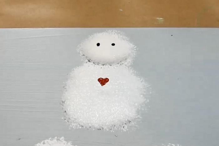 red heart painted on snowman body