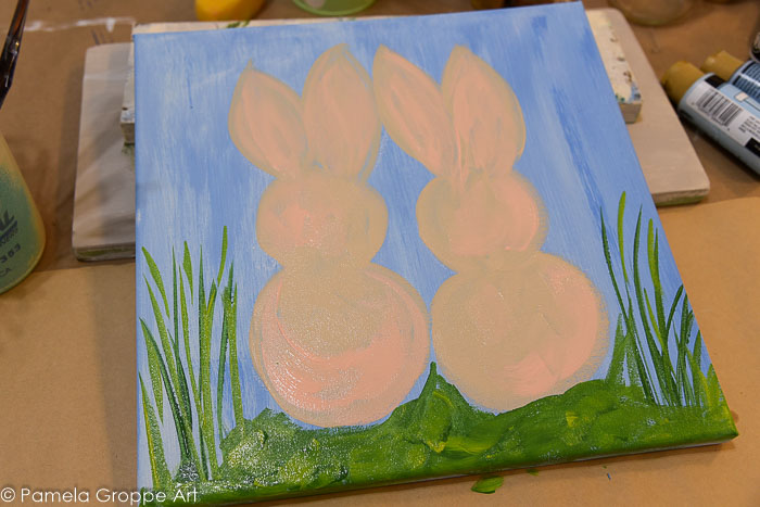 paint grass and stems around bunnies