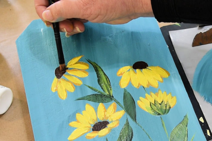 Using Burnt Umber clean up edges of flower center where the Yellow petals crossed into it