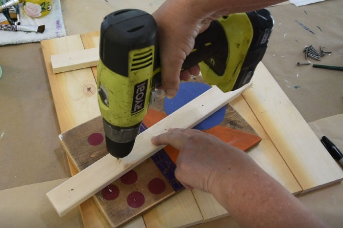 drilling holes in lathing strip for pallet wood board