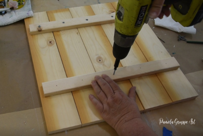 inserting screws into lathing strip and boards