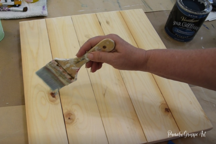 sealing wood pallet board with sealer