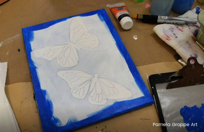 Painting background edges in cerulean blue, how to paint a butterfly