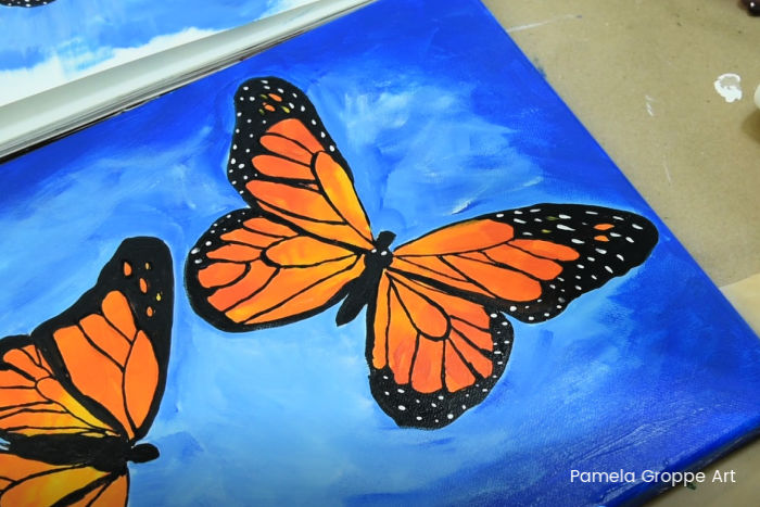 add final details to monarch butterfly painting