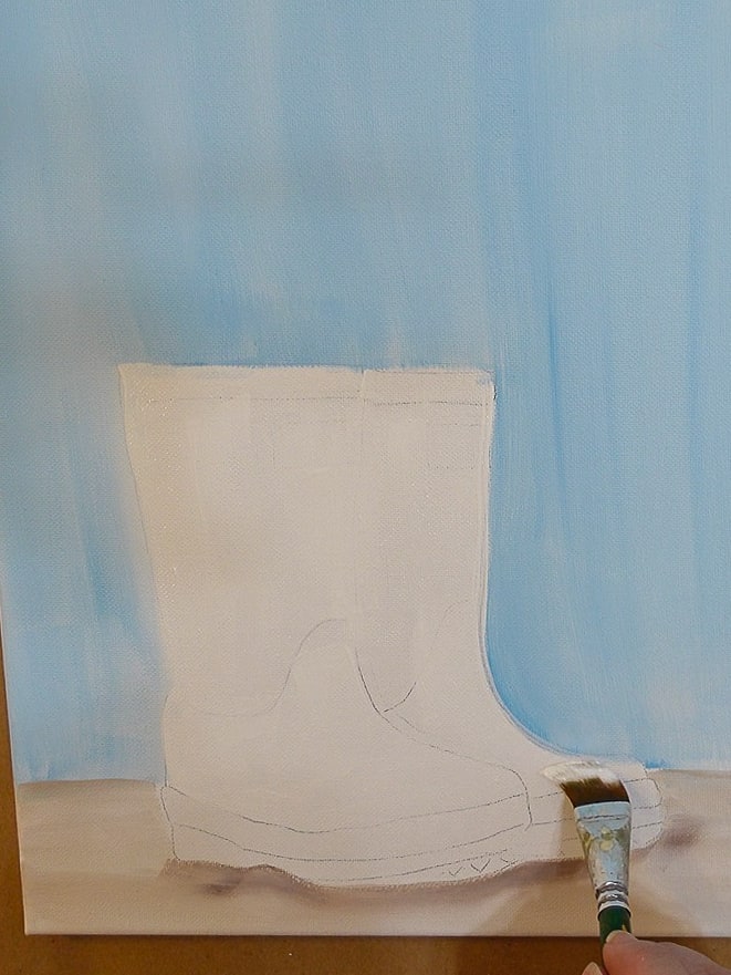 Paint rainboots with white and a large flat brush