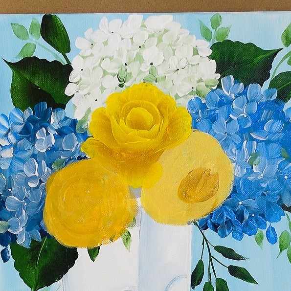 Paint yellow roses in boots finishing center