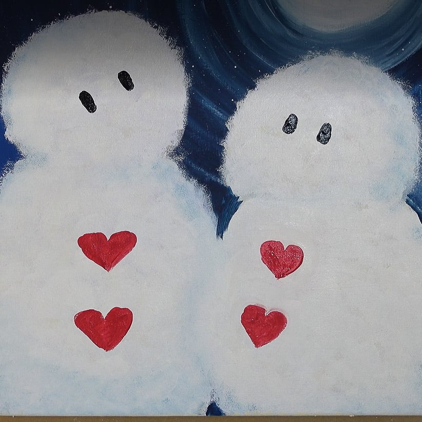 heart buttons and black oval eyes painted on snowman and snow lady