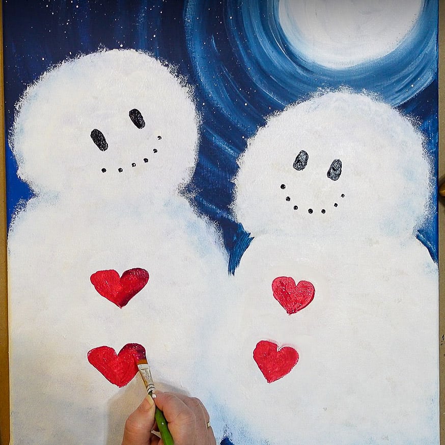 Dot black in smile and then shade heart buttons on snow couple