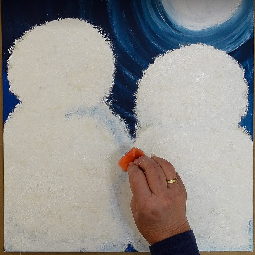 create shading by sponging on blue into wet white paint