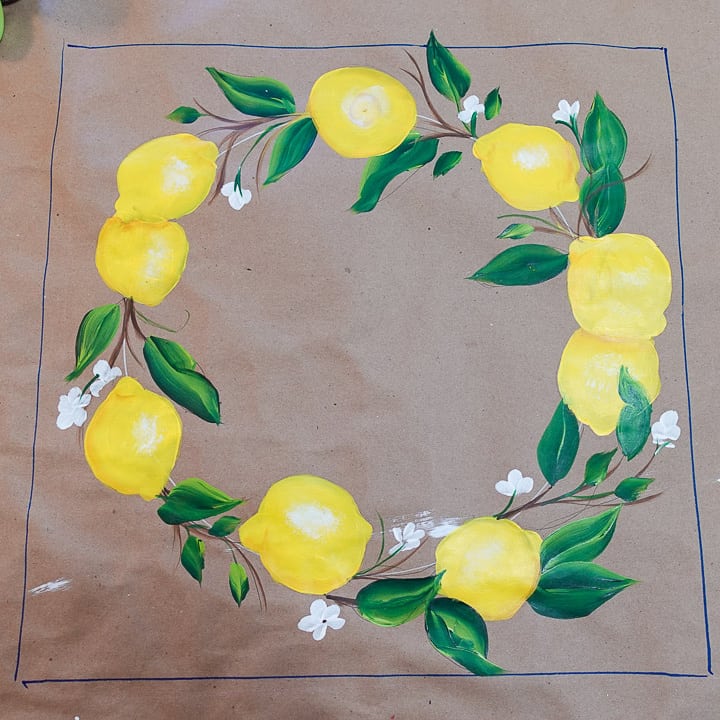 brown craft paper with lemons painted in a circle