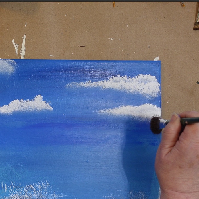 adding second layer of white to cloud painting