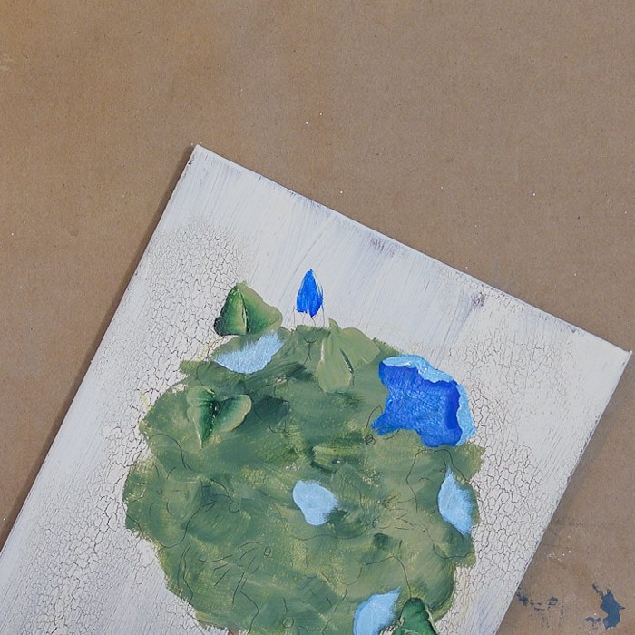 Lighter blue paint added to morning glory topiary painting