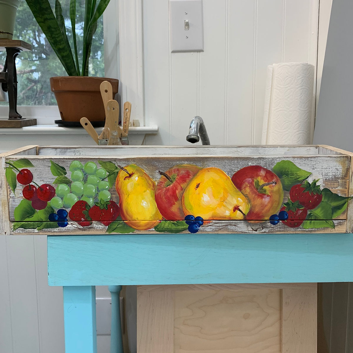 Fruit painted in acrylics on a rustic crate or box