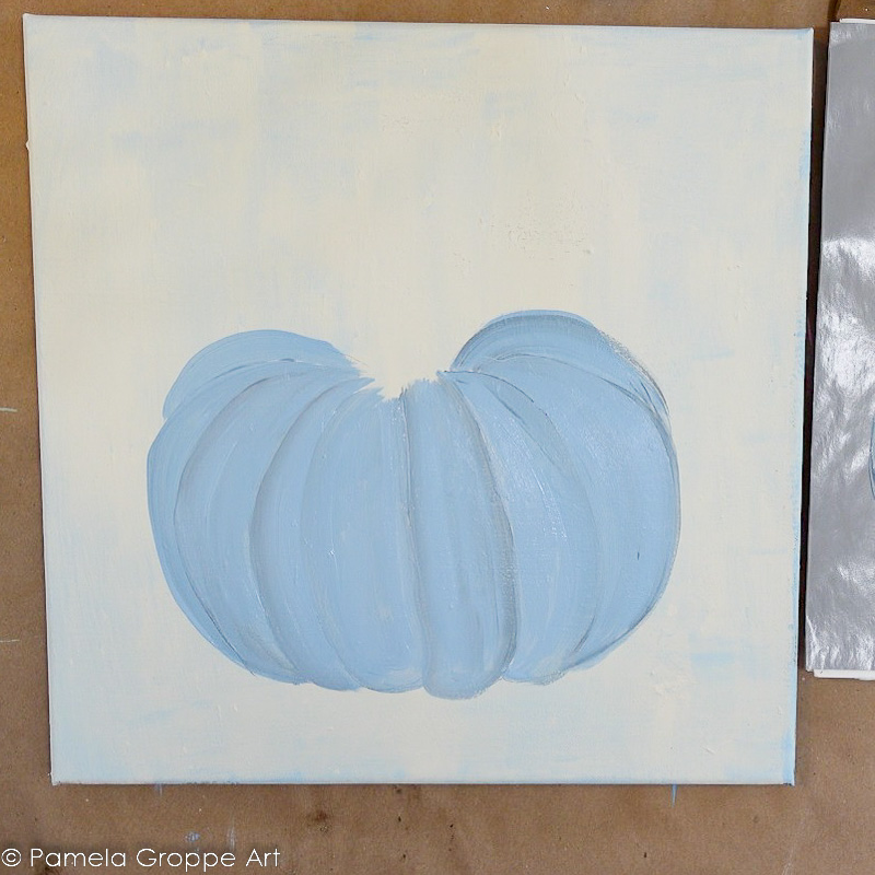 pumpkin painted in blue with creamy white background