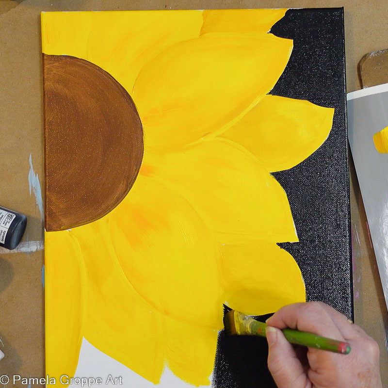 Paint white canvas of sunflower background black with acrylic paint