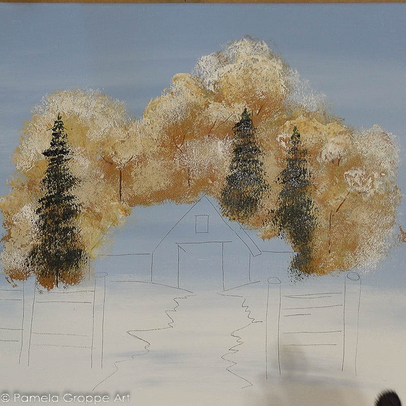 painting winter pine trees with a base coat of darkened green