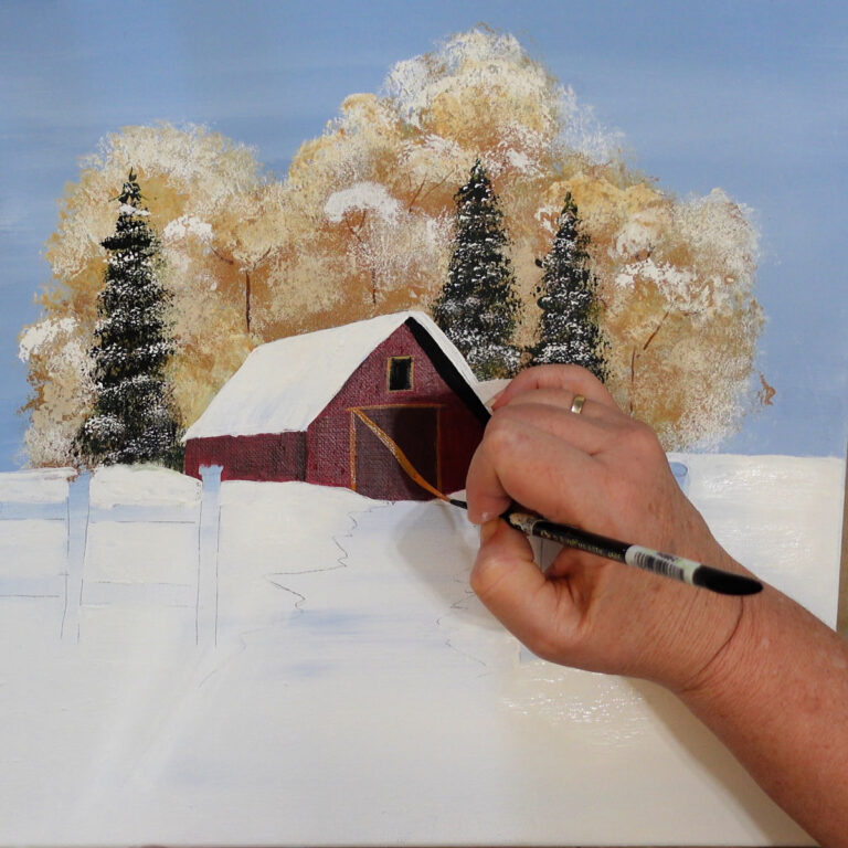 hand shown painting the trim on a barn door in a winter landscape on canvas in acrylics