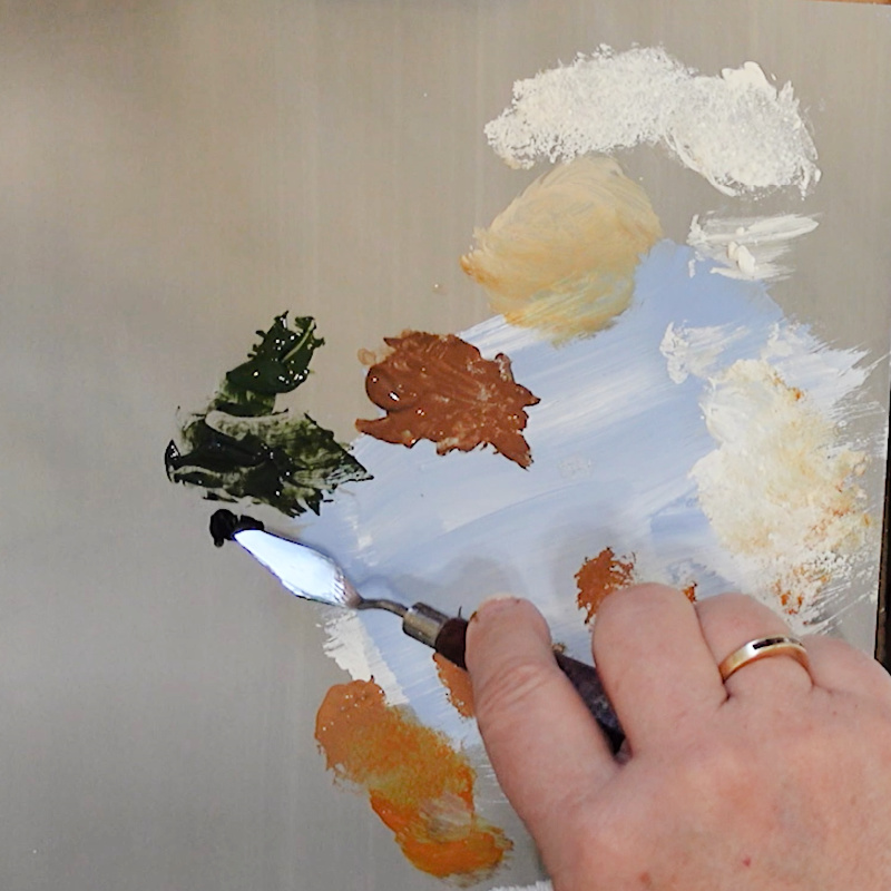 color mixing with a palette knife, dark green with black