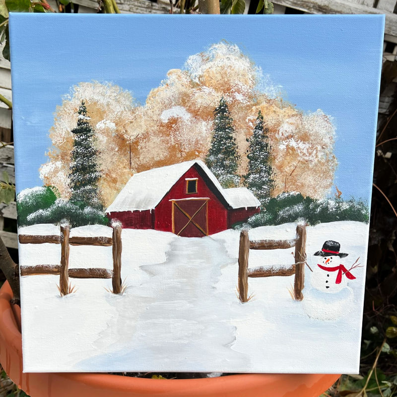 Winter barn landscape painted in acrylics with fence, snowy trees and a snowman.