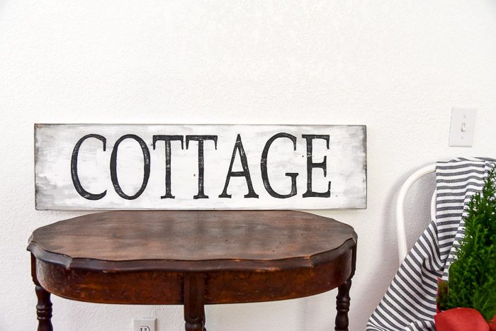 hand painted COTTAGE rustic farm sign on a table