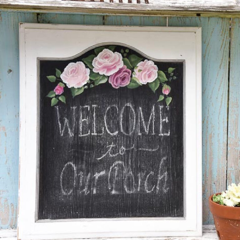 cabinet door painted with chalkboard paint and pink roses