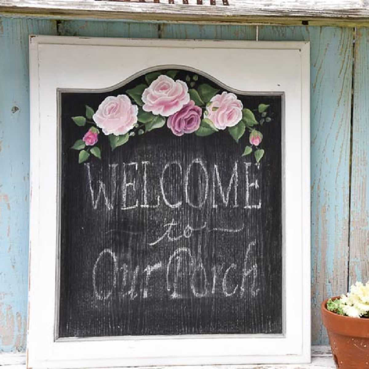 cabinet door painted with chalkboard paint and pink roses