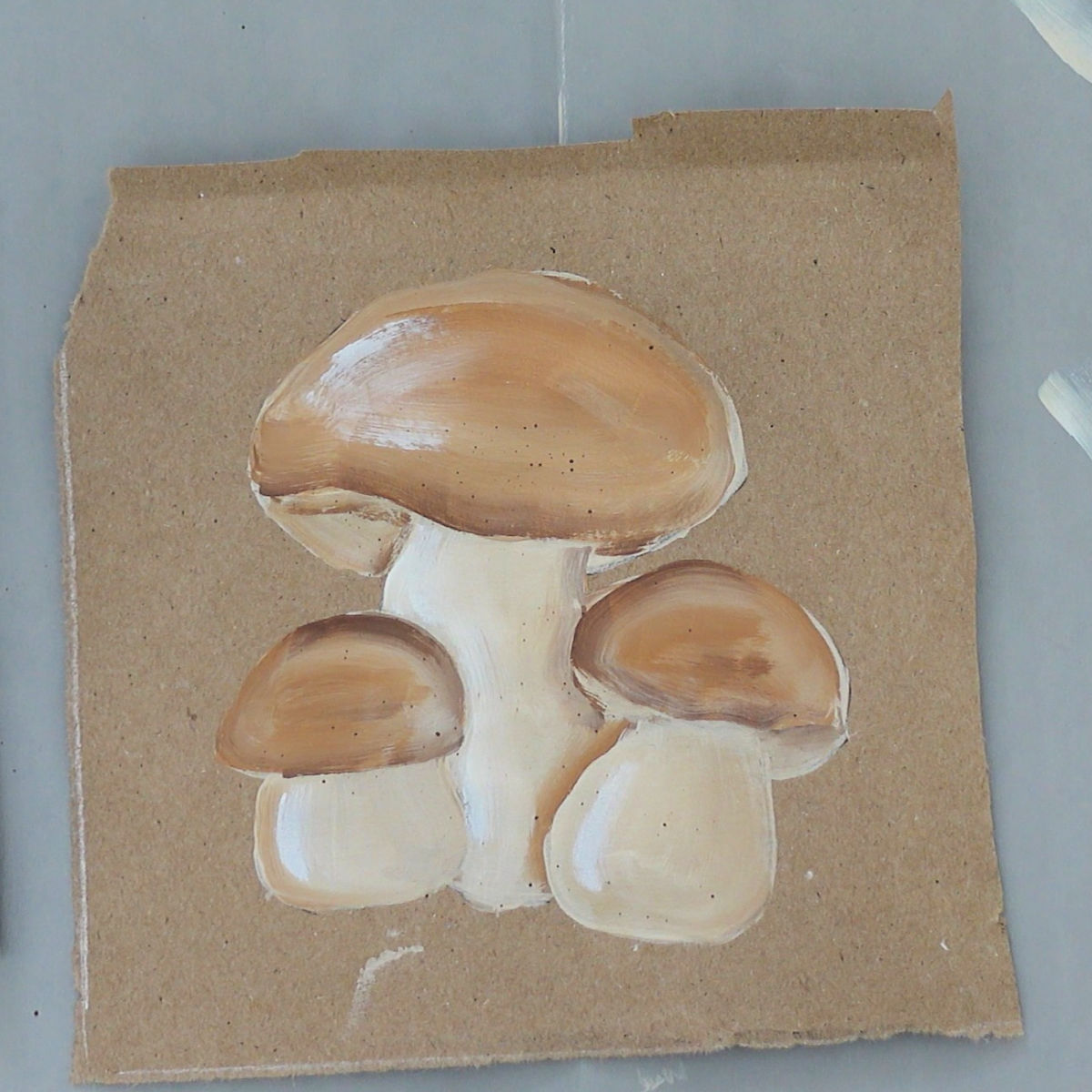 painted brown capped mushrooms in acrylic paint